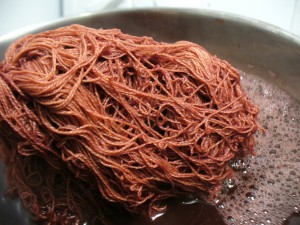 linen yarn in madder bath at 30 minutes